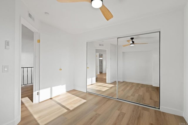 2858 Lehigh Ct, Oceanside, CA 92056 - unfurnished bedroom featuring wood finished floors, baseboards, and a closet