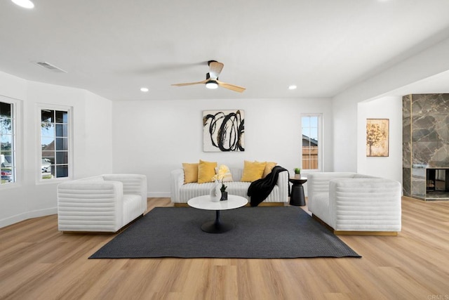 2858 Lehigh Ct, Oceanside, CA 92056 - living area featuring wood finished floors, recessed lighting, baseboards, a ceiling fan, and a fireplace