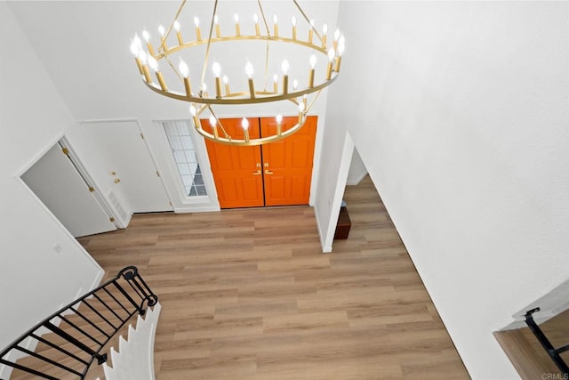 2858 Lehigh Ct, Oceanside, CA 92056 - entrance foyer with a towering ceiling, light wood-type flooring, a chandelier, baseboards, and stairs