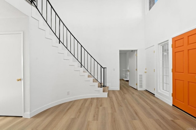 2858 Lehigh Ct, Oceanside, CA 92056 - entrance foyer featuring light wood-style flooring, a towering ceiling, baseboards, and stairway