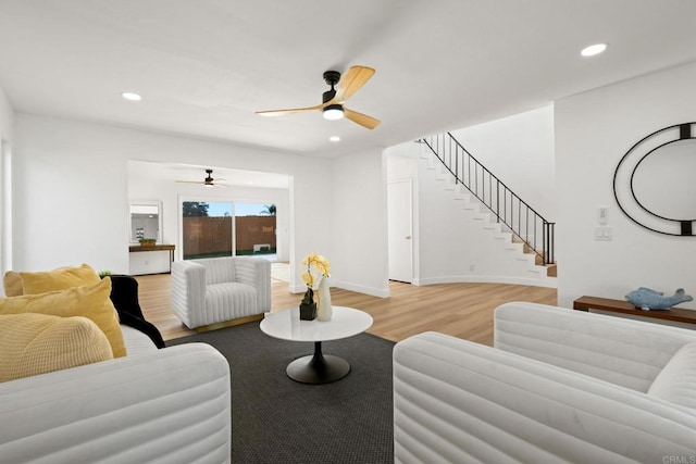 2858 Lehigh Ct, Oceanside, CA 92056 - living area featuring ceiling fan, light wood finished floors, stairway, recessed lighting, and baseboards