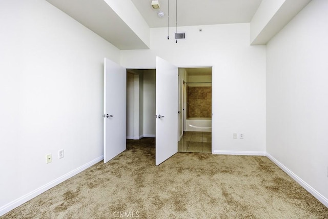 388 E Ocean Blvd Unit 1401, Long Beach, CA 90802 - unfurnished bedroom with carpet floors, baseboards, and ensuite bath