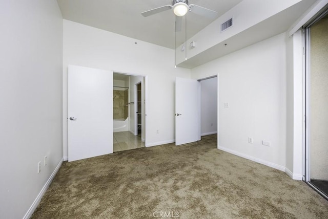 388 E Ocean Blvd Unit 1401, Long Beach, CA 90802 - unfurnished bedroom with carpet floors, connected bathroom, baseboards, and a ceiling fan
