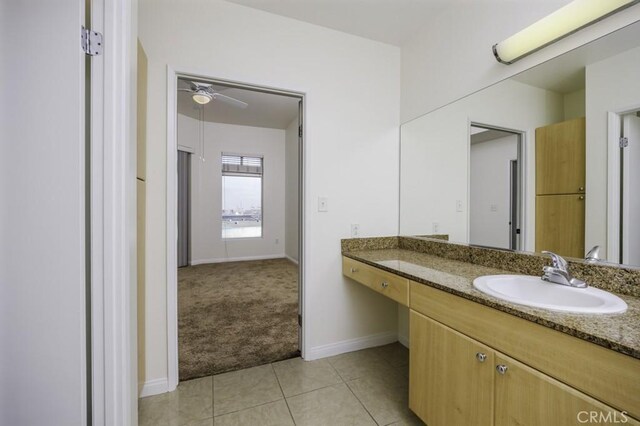 388 E Ocean Blvd Unit 1401, Long Beach, CA 90802 - bathroom with vanity, tile patterned floors, baseboards, and a ceiling fan