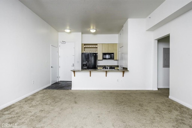 388 E Ocean Blvd Unit 1401, Long Beach, CA 90802 - kitchen featuring black appliances, dark colored carpet, a breakfast bar area, and a peninsula