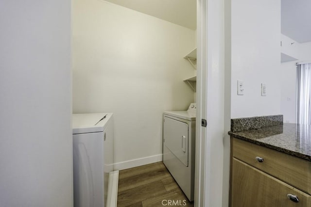 388 E Ocean Blvd Unit 1401, Long Beach, CA 90802 - laundry room featuring dark wood finished floors, independent washer and dryer, and baseboards