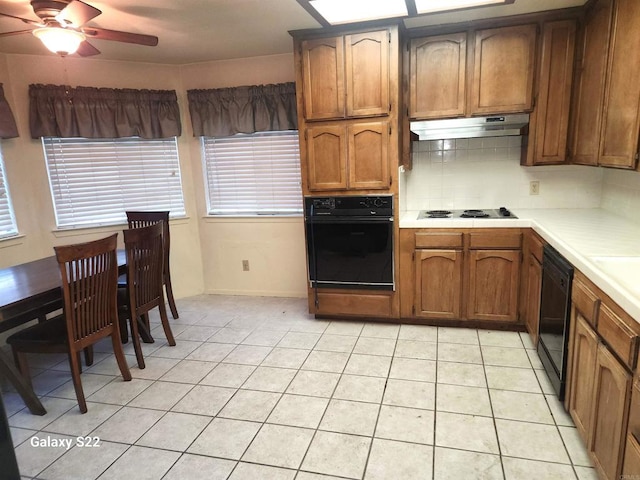 6049 N Constance Ave, Fresno, CA 93722 - kitchen featuring black appliances, ceiling fan, light countertops, decorative backsplash, and light tile patterned floors