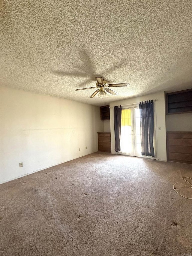 6049 N Constance Ave, Fresno, CA 93722 - unfurnished room with carpet floors, ceiling fan, and a textured ceiling