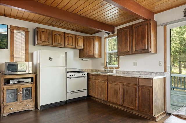 33133 Ridge Rd, Arrowbear, CA 92382 - kitchen with white appliances, a sink, wood ceiling with exposed beams, light countertops, and dark wood-type flooring