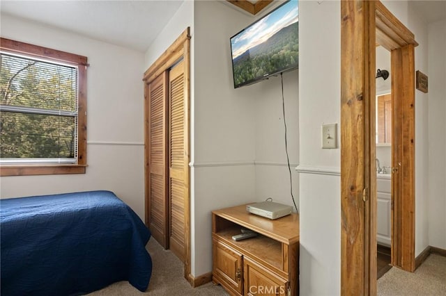 33133 Ridge Rd, Arrowbear, CA 92382 - bedroom with light carpet, a closet, and baseboards