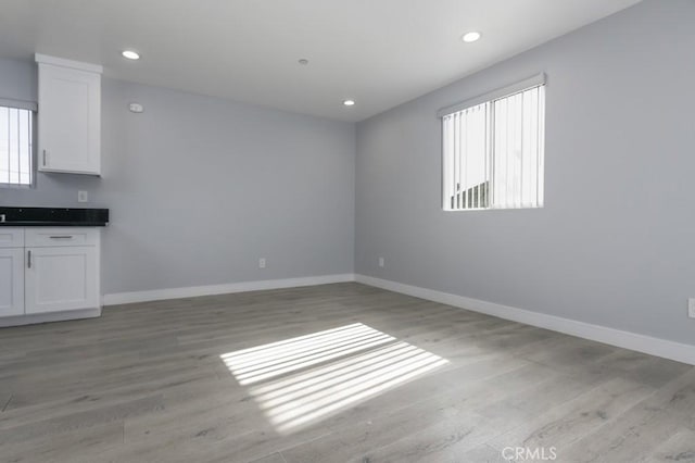529 W 80th St, Los Angeles, CA 90044 - unfurnished room with light wood-style floors, baseboards, and recessed lighting