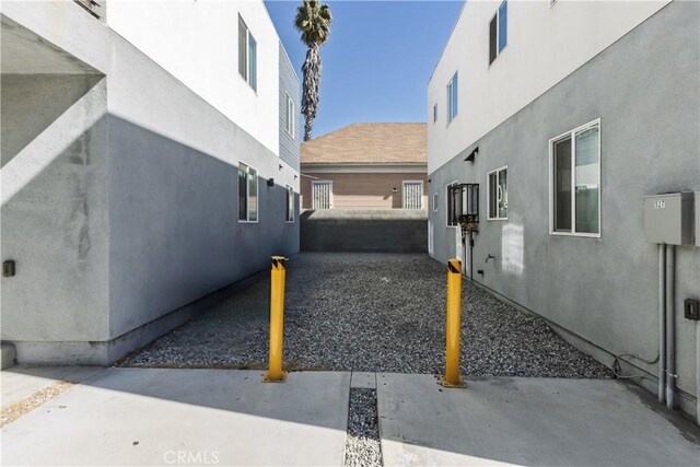 529 W 80th St, Los Angeles, CA 90044 - view of side of property featuring stucco siding