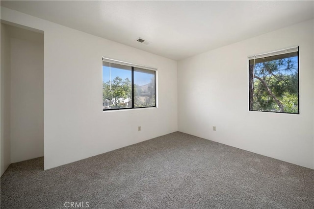 2975 Rockview Pl # 2, San Luis Obispo, CA 93401 - unfurnished room featuring healthy amount of natural light and carpet flooring