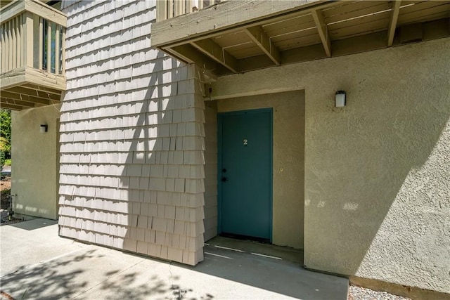 2975 Rockview Pl # 2, San Luis Obispo, CA 93401 - view of exterior entry with a balcony and stucco siding