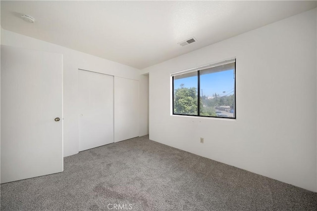 2975 Rockview Pl # 2, San Luis Obispo, CA 93401 - unfurnished bedroom featuring carpet and a closet