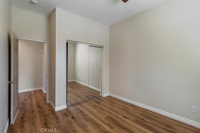 13410 Goldmedal Ave, Chino, CA 91710 - unfurnished bedroom with wood finished floors, a closet, and baseboards