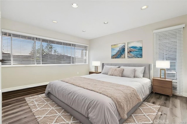15500 Tustin Village Way Unit 28, Tustin, CA 92780 - bedroom with wood finished floors, recessed lighting, and baseboards