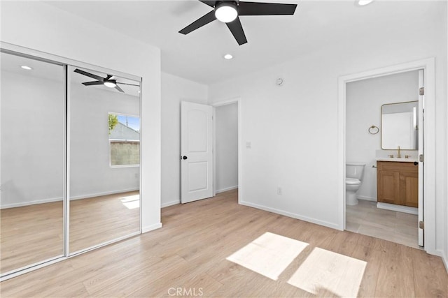 15447 Romar St, Mission Hills San Fernando, CA 91345 - unfurnished bedroom featuring a sink, light wood-style floors, ensuite bath, recessed lighting, and a closet