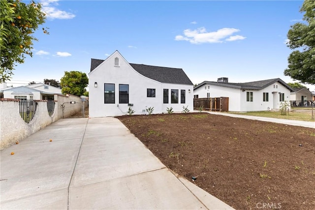 15447 Romar St, Mission Hills San Fernando, CA 91345 - modern inspired farmhouse with stucco siding, a shingled roof, and driveway