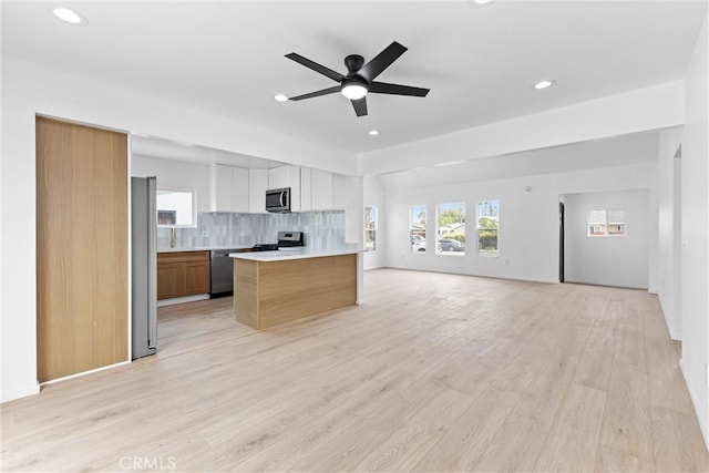 15447 Romar St, Mission Hills San Fernando, CA 91345 - kitchen with open floor plan, stainless steel appliances, light countertops, recessed lighting, and tasteful backsplash
