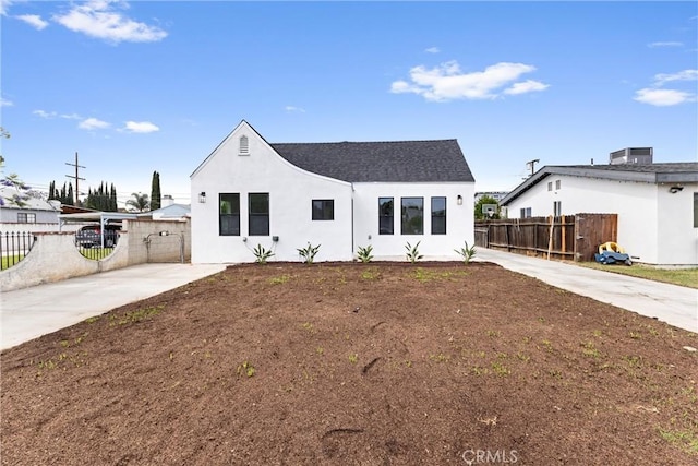 15447 Romar St, Mission Hills San Fernando, CA 91345 - modern farmhouse style home with stucco siding, driveway, and roof with shingles