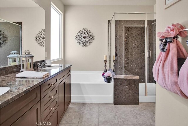11156 Camden St, Apple Valley, CA 92308 - bathroom featuring a stall shower, a garden tub, double vanity, and tile patterned flooring