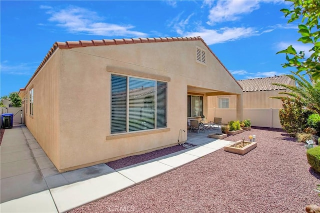 11156 Camden St, Apple Valley, CA 92308 - rear view of property with a patio area, stucco siding, and a tile roof