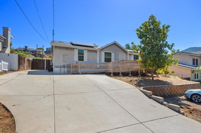133 Frances Dr, El Cajon, CA 92019 - ranch-style house featuring roof mounted solar panels, driveway, and a deck