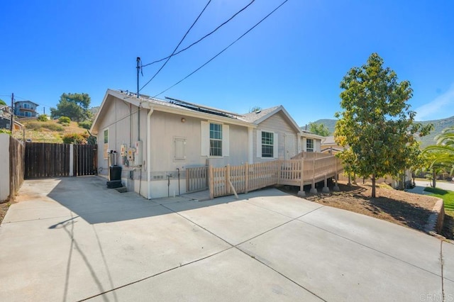133 Frances Dr, El Cajon, CA 92019 - view of front of home featuring a deck, solar panels, and a patio