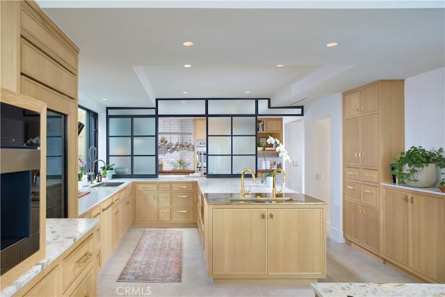 17 Muir Beach Cir, Corona Del Mar, CA 92625 - kitchen with light brown cabinets, a sink, light stone counters, and recessed lighting