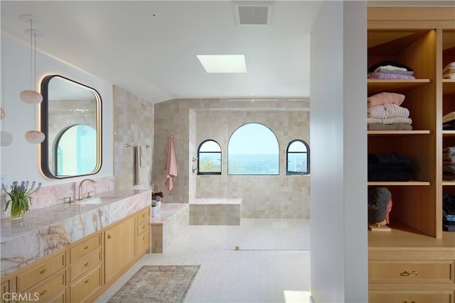 17 Muir Beach Cir, Corona Del Mar, CA 92625 - full bathroom with vanity, a skylight, and a walk in shower