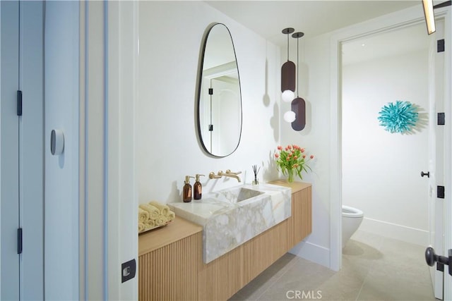 17 Muir Beach Cir, Corona Del Mar, CA 92625 - bathroom featuring toilet, vanity, and baseboards