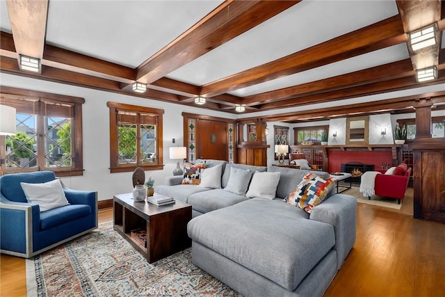 4039 W 7th St, Los Angeles, CA 90005 - living area with beam ceiling, wood finished floors, a fireplace, and baseboards