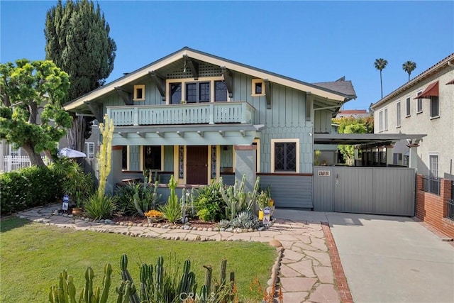 4039 W 7th St, Los Angeles, CA 90005 - view of front of property featuring board and batten siding, a balcony, and a porch