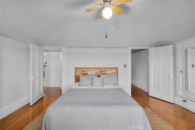 4039 W 7th St, Los Angeles, CA 90005 - bedroom with wood finished floors, baseboards, and a ceiling fan