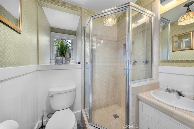 4039 W 7th St, Los Angeles, CA 90005 - full bathroom featuring a shower stall, vanity, and a wainscoted wall