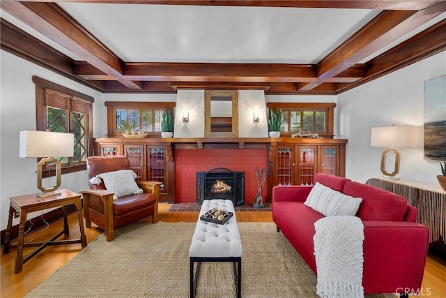 4039 W 7th St, Los Angeles, CA 90005 - living room featuring wood finished floors, coffered ceiling, a fireplace, plenty of natural light, and beamed ceiling