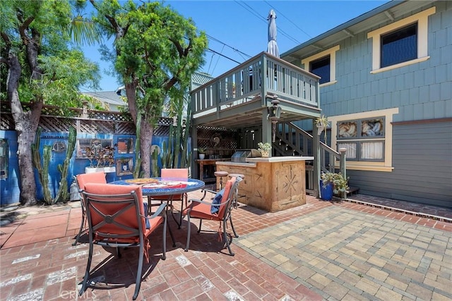 4039 W 7th St, Los Angeles, CA 90005 - view of patio / terrace with a wooden deck, outdoor dining area, and stairway