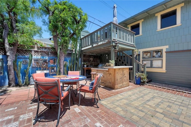 4039 W 7th St, Los Angeles, CA 90005 - view of patio / terrace featuring a wooden deck, outdoor dining space, and stairway