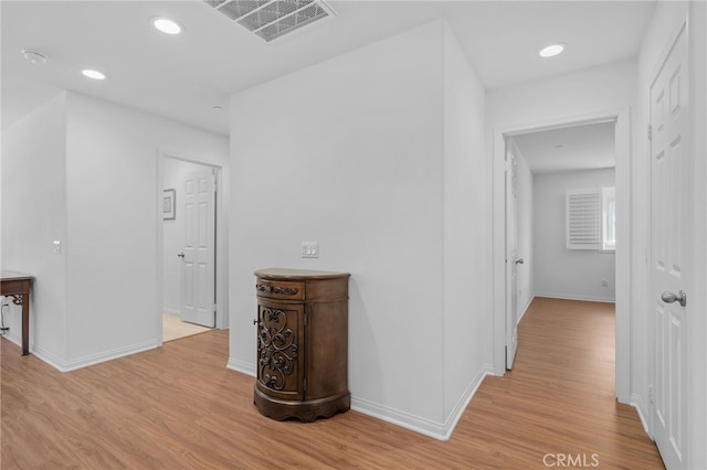 11757 Stonefield Dr, Corona, CA 92883 - hallway featuring light wood finished floors, baseboards, and recessed lighting