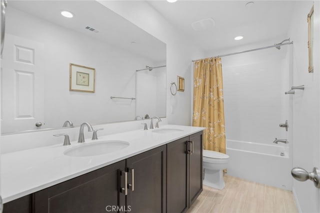 11757 Stonefield Dr, Corona, CA 92883 - bathroom featuring toilet, shower / bath combo, double vanity, and recessed lighting
