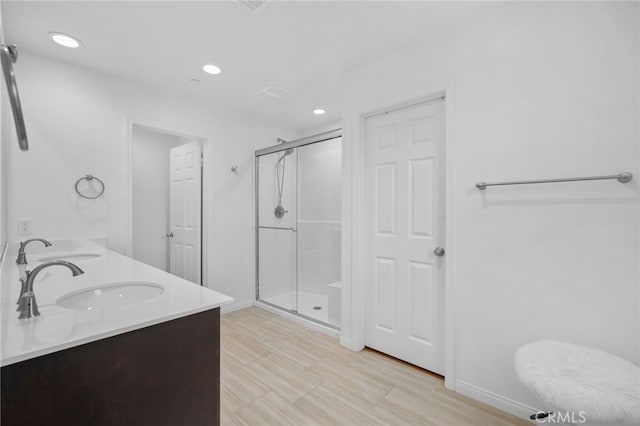 11757 Stonefield Dr, Corona, CA 92883 - bathroom with a shower stall, double vanity, recessed lighting, and baseboards