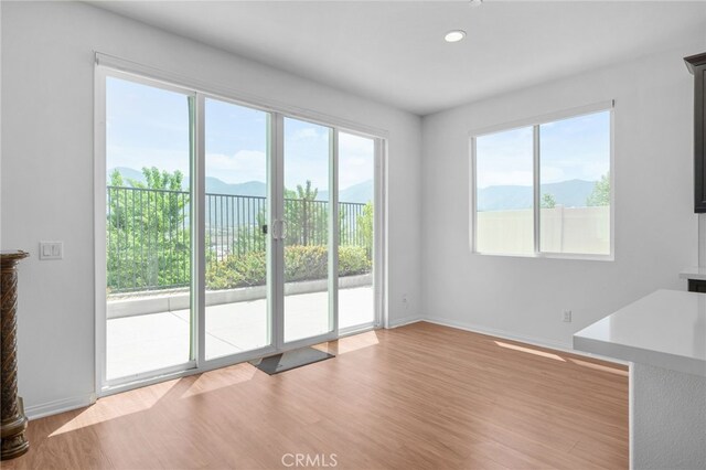 11757 Stonefield Dr, Corona, CA 92883 - spare room with a mountain view, light wood-style floors, baseboards, and recessed lighting
