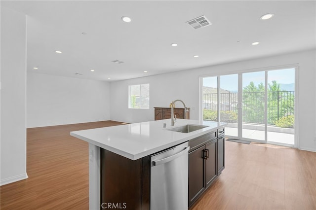 11757 Stonefield Dr, Corona, CA 92883 - kitchen with stainless steel dishwasher, a sink, light wood-style flooring, recessed lighting, and light countertops