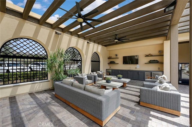 11757 Stonefield Dr, Corona, CA 92883 - living area featuring a ceiling fan, brick floors, and beam ceiling