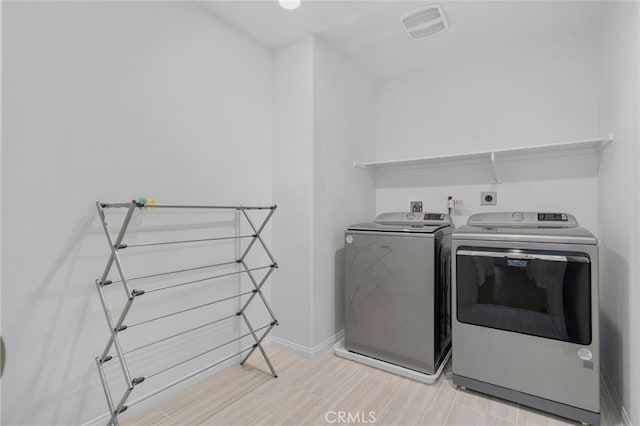 11757 Stonefield Dr, Corona, CA 92883 - washroom with washer and dryer and baseboards