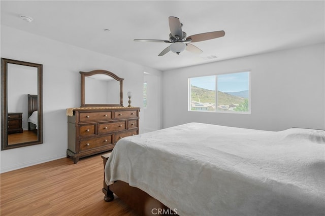 11757 Stonefield Dr, Corona, CA 92883 - bedroom with light wood-style flooring, baseboards, and a ceiling fan