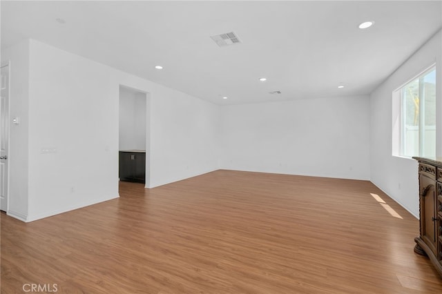 11757 Stonefield Dr, Corona, CA 92883 - spare room featuring light wood-style flooring, recessed lighting, and baseboards