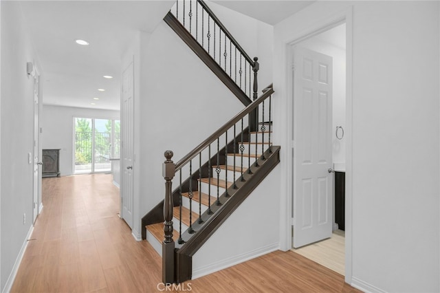 11757 Stonefield Dr, Corona, CA 92883 - staircase with wood finished floors, recessed lighting, and baseboards