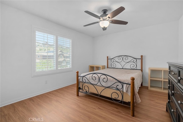 11757 Stonefield Dr, Corona, CA 92883 - bedroom with light wood finished floors, baseboards, and ceiling fan